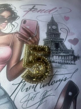 Chanel number  5 brooch to inspire the queen in you